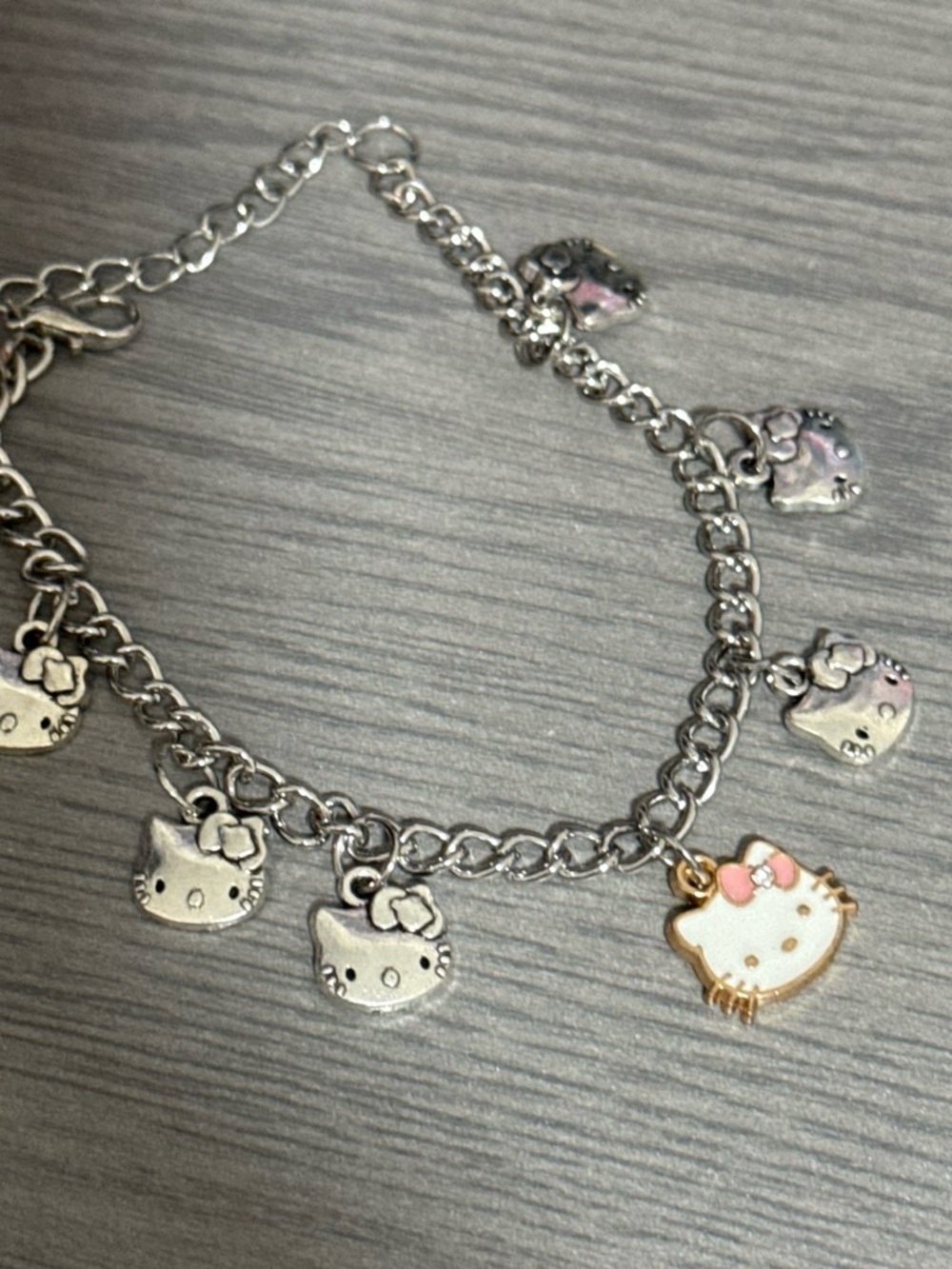 Hello Kitty Silver-Tone Charm Bracelet with Pink Bow Accent